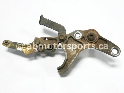 Used Yamaha ATV GRIZZLY 660 SE OEM part # 5KM-27263-00-00 rear brake mount bracket for sale